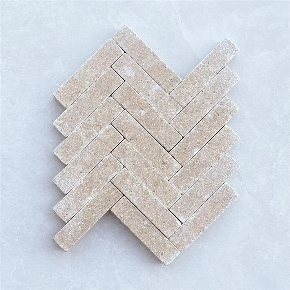 Dijon limestone brick cobbles in a herringbone layout